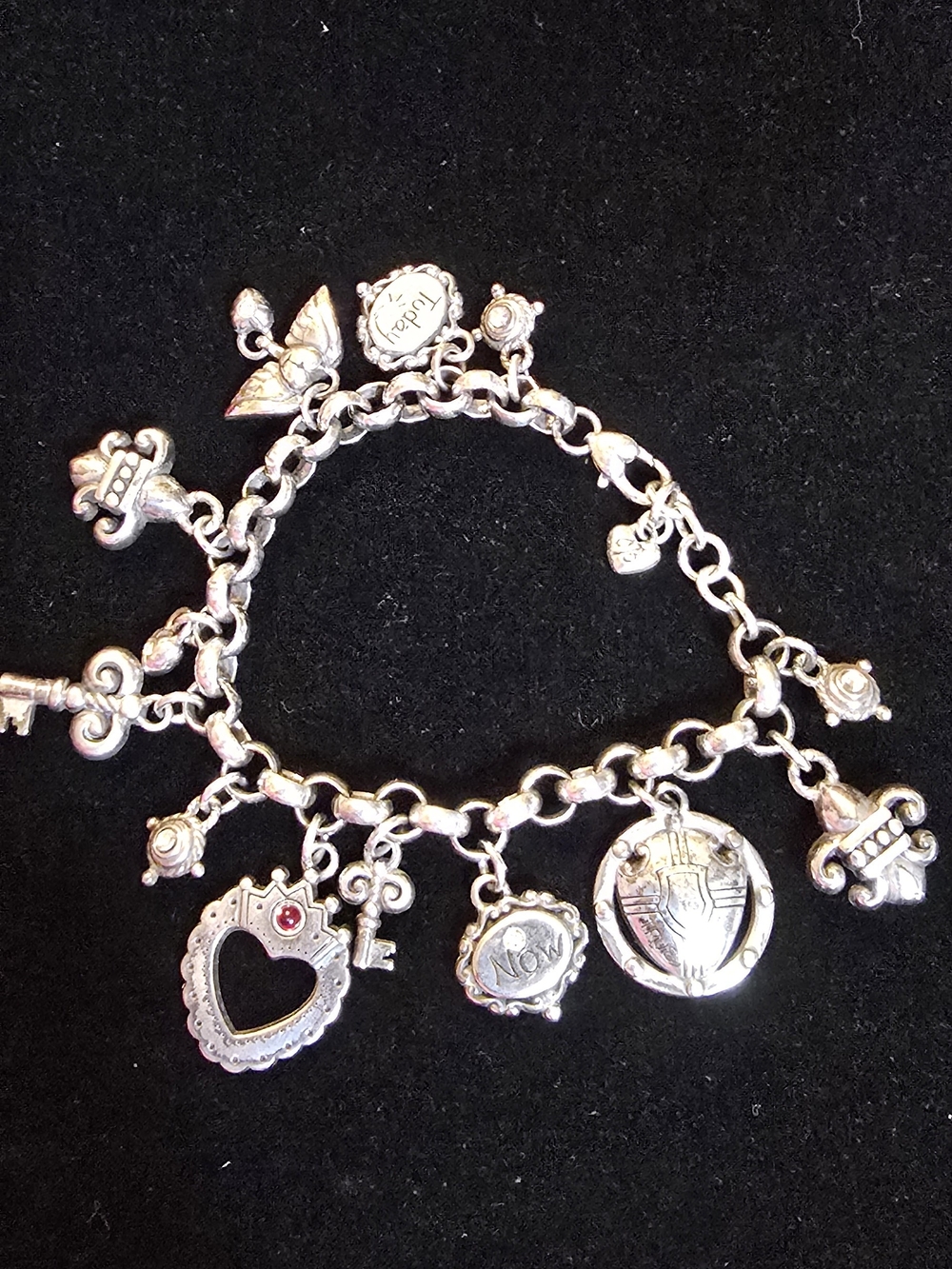 Brighton Charm Bracelet featuring a distinctive "Now" heart charm
